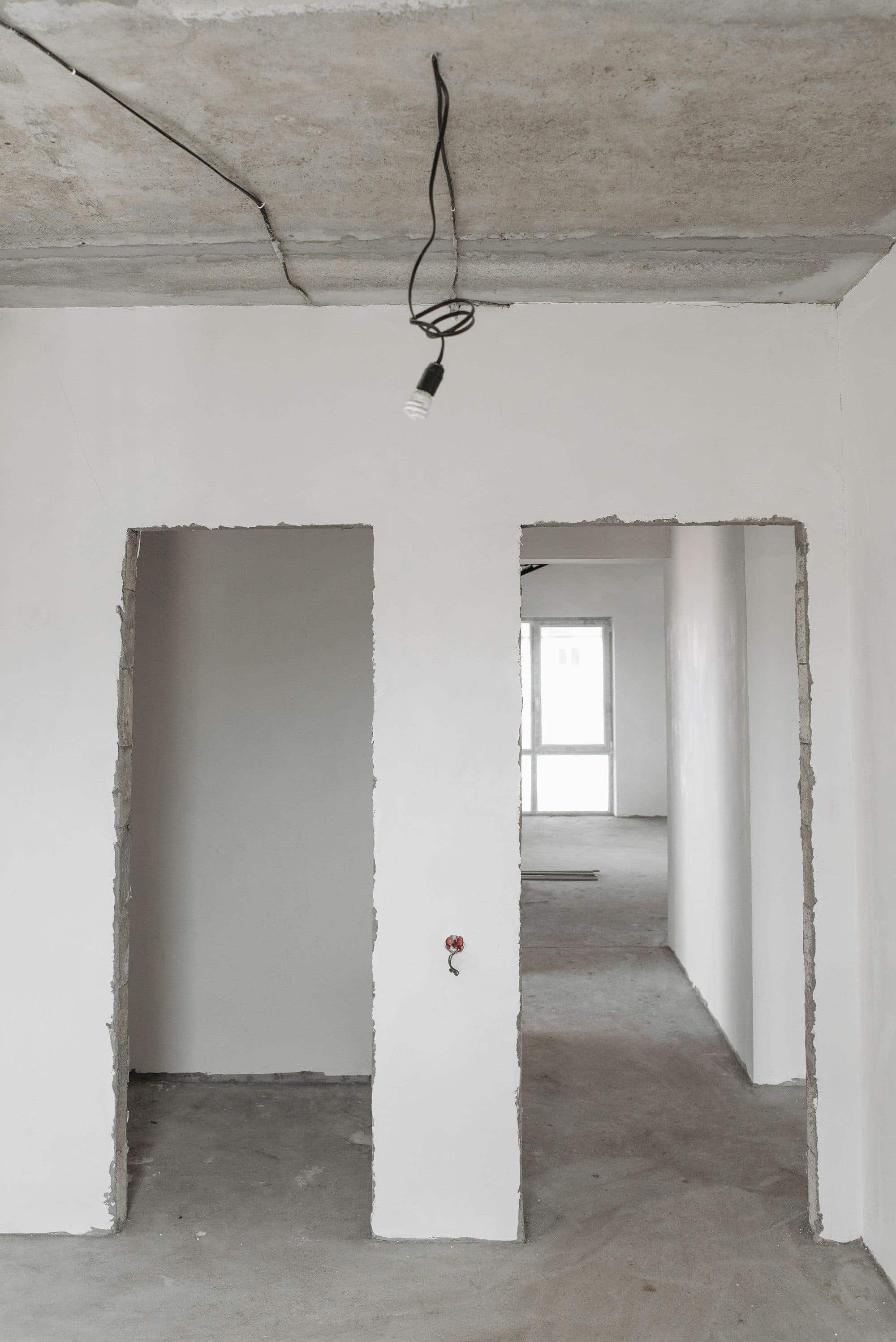 Bare interior shell at lock-up, before the rough clean